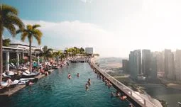 Happy in Singapore, or saving money in Hong Kong?