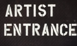 A sign that says artist entrance