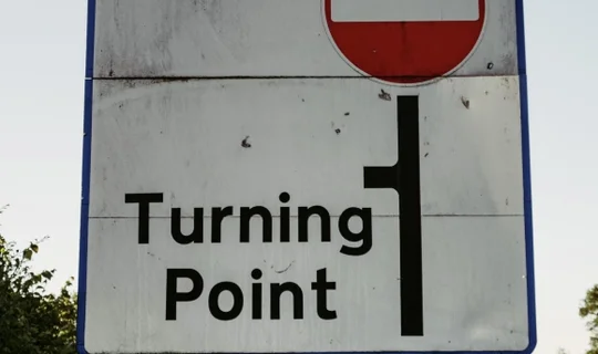 A sign that says turning point 