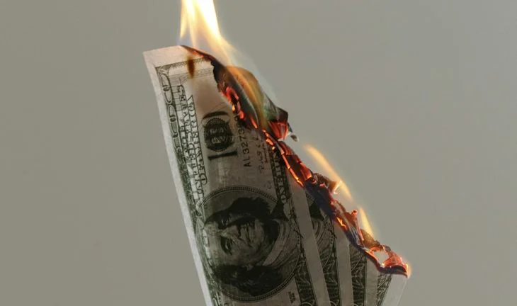burning dollars