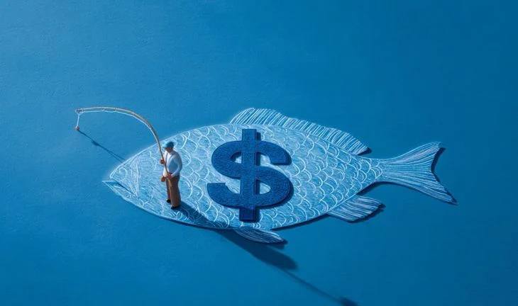 A man with a fishing rod standing in a fish with a $ sign