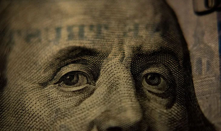Benjamin Franklin eyes on a dollar bill